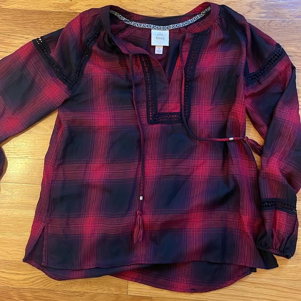 Red plaid shirt with little bit of black accents to it